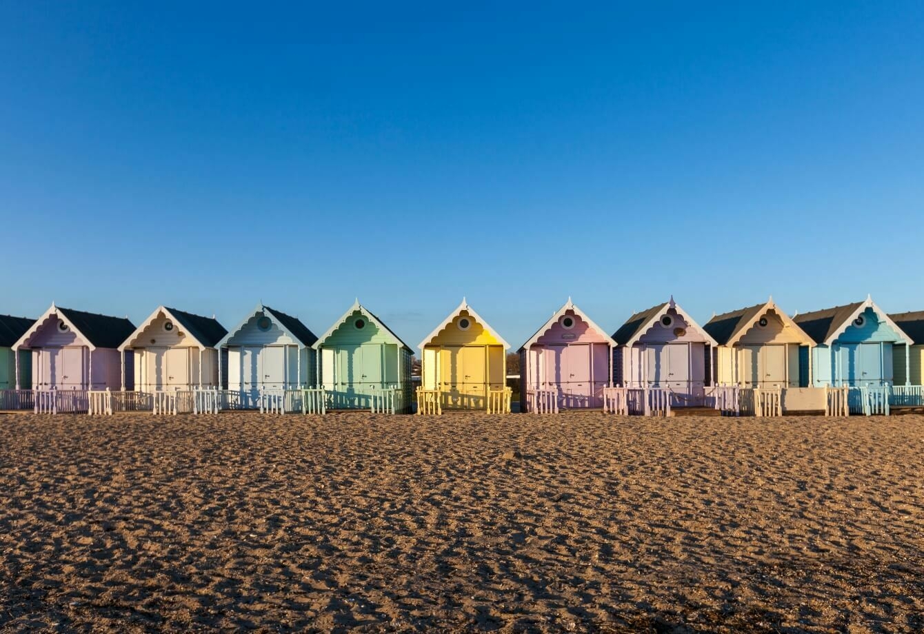 Beach huts on West Mersea beach - Reasons to buy a new build home in Essex